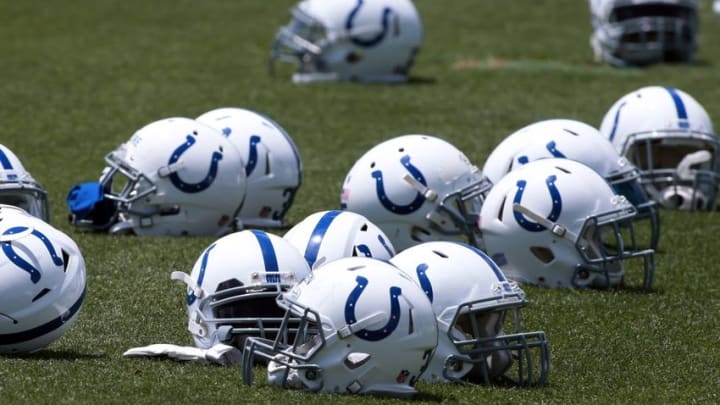 Jun 7, 2016; Indianapolis, IN, USA; Indianapolis Colts lay their helmets on the field as they stretch during mini camp at the Indiana Farm Bureau Center. Mandatory Credit: Brian Spurlock-USA TODAY Sports