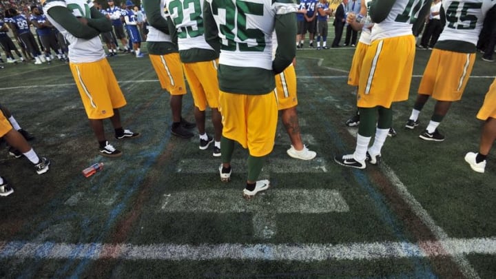 Aug 7, 2016; Canton, OH, USA; Green Bay Packers players stand on the center logo, which was deemed unsafe for play at the 2016 Hall of Fame Game at Tom Benson Hall of Fame Stadium. Mandatory Credit: Ken Blaze-USA TODAY Sports Aug 7, 2016; Canton, OH, USA; Green Bay Packers players stand on the center logo, which was deemed unsafe for play at the 2016 Hall of Fame Game at Tom Benson Hall of Fame Stadium. Mandatory Credit: Ken Blaze-USA TODAY Sports