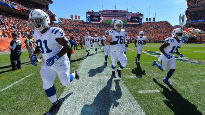Sep 18, 2016; Denver, CO, USA; Indianapolis Colts defensive tackle Hassan Ridgeway (91) and offensive tackle Joe Reitz (76) and wide receiver Phillip Dorsett (15) and wide receiver Chester Rogers (80) run onto the field before the game against the Denver Broncos at Sports Authority Field at Mile High. Mandatory Credit: Ron Chenoy-USA TODAY Sports