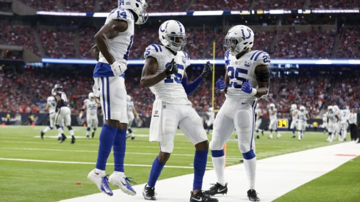 HOUSTON, TX - JANUARY 05: Dontrelle Inman #15 of the Indianapolis Colts celebrates with Marlon Mack #25 and Zach Pascal #14 after a touchdown reception in the second quarter against the Houston Texans during the Wild Card Round at NRG Stadium on January 5, 2019 in Houston, Texas. (Photo by Tim Warner/Getty Images)