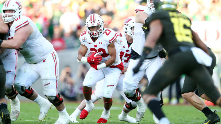 PASADENA, CALIFORNIA – JANUARY 01: Jonathan Taylor #23 of the Wisconsin Badgers runs the ball against the Oregon Ducks during the second quarter in the Rose Bowl game presented by Northwestern Mutual at Rose Bowl on January 01, 2020 in Pasadena, California. (Photo by Joe Scarnici/Getty Images)
