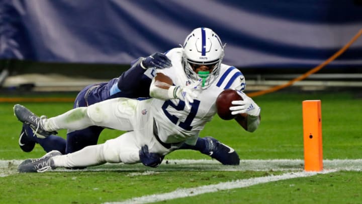NASHVILLE, TENNESSEE - NOVEMBER 12: Nyheim Hines #21 of the Indianapolis Colts dives for a touchdown against Jayon Brown #55 of the Tennessee Titans during the first half 1at Nissan Stadium on November 12, 2020 in Nashville, Tennessee. (Photo by Wesley Hitt/Getty Images)