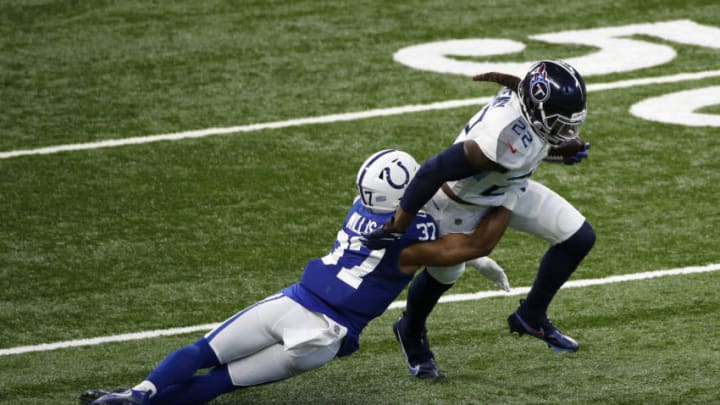 INDIANAPOLIS, INDIANA - NOVEMBER 29: Derrick Henry #22 of the Tennessee Titans attempts to break a tackle from Khari Willis #37 of the Indianapolis Colts during their game at Lucas Oil Stadium on November 29, 2020 in Indianapolis, Indiana. (Photo by Michael Hickey/Getty Images)