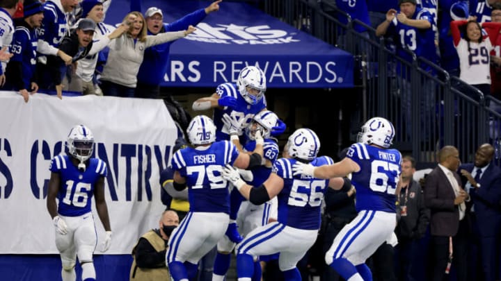 INDIANAPOLIS, INDIANA - DECEMBER 18: Jonathan Taylor #28 of the Indianapolis Colts celebrates his touchdown with teammates during the fourth quarter against the New England Patriots at Lucas Oil Stadium on December 18, 2021 in Indianapolis, Indiana. (Photo by Justin Casterline/Getty Images)