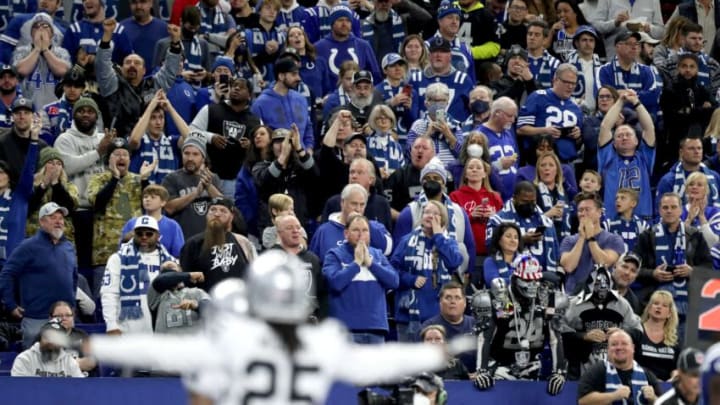 Fans react after a Indianapolis Colts quarterback Carson Wentz (2) pass goes incomplete in the end zone Sunday, Jan. 2, 2022, during a game against the Las Vegas Raiders at Lucas Oil Stadium in Indianapolis.