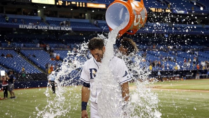 Apr 26, 2016; St. Petersburg, FL, USA; Tampa Bay Rays starting pitcher Chris Archer (22) pours water on center fielder Kevin Kiermaier (39) after they beat the Baltimore Orioles at Tropicana Field. Tampa Bay Rays defeated the Baltimore Orioles 3-1. Mandatory Credit: Kim Klement-USA TODAY Sports