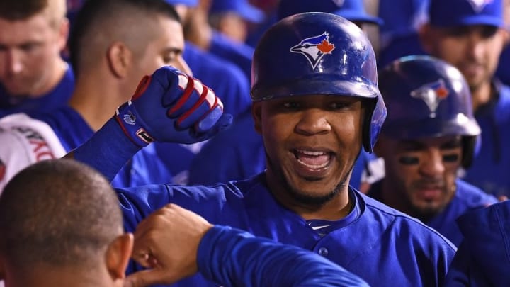 Sep 16, 2016; Anaheim, CA, USA; Toronto Blue Jays first baseman Edwin Encarnacion (10) is greeted in the dugout after a two-run home run in the ninth inning of the game against the Los Angeles Angels at Angel Stadium of Anaheim. Mandatory Credit: Jayne Kamin-Oncea-USA TODAY Sports