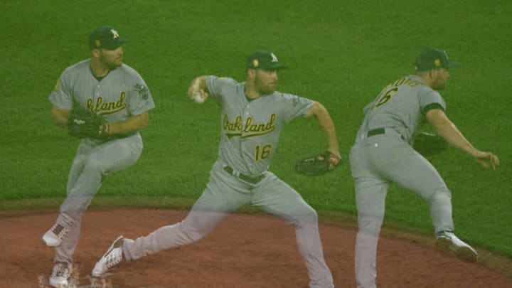 BALTIMORE, MD - SEPTEMBER 12: (EDITORS NOTE: Multiple exposures were combined in camera to produce this image.) Liam Hendriks #16 of the Oakland Athletics pitches during a baseball game against the Baltimore Orioles at Oriole Park at Camden Yards on September 12, 2018 in Baltimore, Maryland. (Photo by Mitchell Layton/Getty Images)