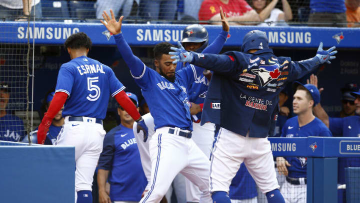 TORONTO, ON - OCTOBER 02: George Springer #4 of the Toronto Blue Jays celebrates with Teoscar Hernnadez #37 after hitting a three-run home run in the second inning during a MLB game against the Baltimore Orioles at Rogers Centre on October 2, 2021 in Toronto, Ontario, Canada. (Photo by Vaughn Ridley/Getty Images) TORONTO, ON - OCTOBER 02: George Springer #4 of the Toronto Blue Jays celebrates with Teoscar Hernnadez #37 after hitting a three-run home run in the second inning during a MLB game against the Baltimore Orioles at Rogers Centre on October 2, 2021 in Toronto, Ontario, Canada. (Photo by Vaughn Ridley/Getty Images)