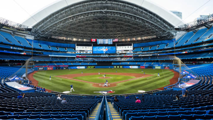 TORONTO, ON - JULY 09: Toronto Blue Jays players take part in an intrasquad game at Rogers Centre on July 9, 2020 in Toronto, Canada. (Photo by Mark Blinch/Getty Images) TORONTO, ON - JULY 09: Toronto Blue Jays players take part in an intrasquad game at Rogers Centre on July 9, 2020 in Toronto, Canada. (Photo by Mark Blinch/Getty Images)
