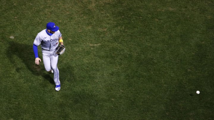 BOSTON, MASSACHUSETTS - SEPTEMBER 05: Derek Fisher #23 of the Toronto Blue Jays fields a ball in the outfield during the fifth inning of the game against the Boston Red Sox at Fenway Park on September 05, 2020 in Boston, Massachusetts. (Photo by Omar Rawlings/Getty Images)