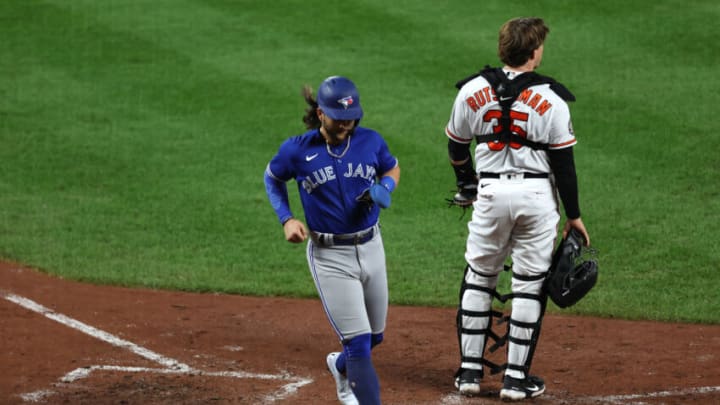 BALTIMORE, MARYLAND - SEPTEMBER 07: Bo Bichette #11 of the Toronto Blue Jays scores a run against the Baltimore Orioles during the fifth inning at Oriole Park at Camden Yards on September 07, 2022 in Baltimore, Maryland. (Photo by Patrick Smith/Getty Images)