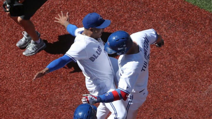 TORONTO, ON - JULY 8: Troy Tulowitzki #2 of the Toronto Blue Jays is congratulated by Marcus Stroman #6 after hitting a three-run home run in the seventh inning during MLB game action against the Houston Astros at Rogers Centre on July 8, 2017 in Toronto, Canada. (Photo by Tom Szczerbowski/Getty Images)