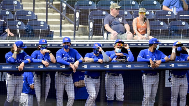 TAMPA, FLORIDA - FEBRUARY 28: Toronto Blue Jays players stand in the dugout prior to the game against the New York Yankees during a spring training game at George M. Steinbrenner Field on February 28, 2021 in Tampa, Florida. (Photo by Douglas P. DeFelice/Getty Images)