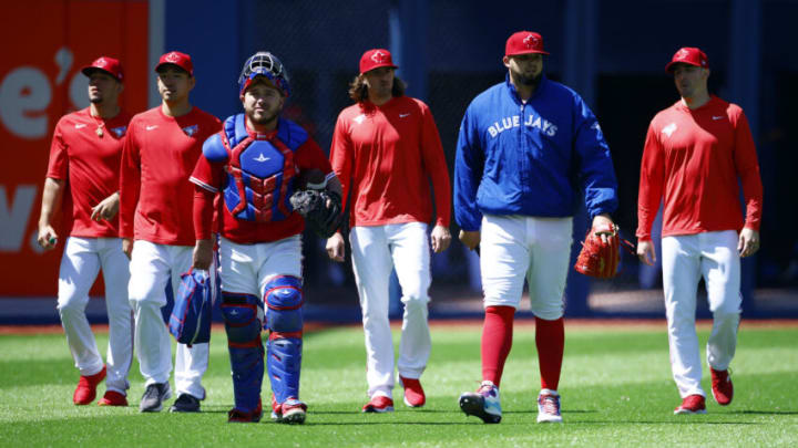 TORONTO, ON - JUNE 18: Starting pitcher Alek Manoah #6 and catcher Alejandro Kirk #30 of the Toronto Blue Jays walk from the bullpen to the dugout along with the Blue Jays starting rotation of Jose Berrios #17, Yusei Kikuchi #16, Kevin Gausman #34 and Ross Stripling #48 prior to a MLB game against the New York Yankees at Rogers Centre on June 18, 2022 in Toronto, Ontario, Canada. (Photo by Vaughn Ridley/Getty Images)