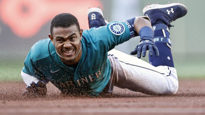 SEATTLE, WASHINGTON - JULY 08: Julio Rodriguez #44 of the Seattle Mariners dives short of third base and eventually was tagged out during the first inning against the Toronto Blue Jays at T-Mobile Park on July 08, 2022 in Seattle, Washington. (Photo by Steph Chambers/Getty Images)