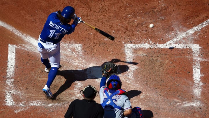 TORONTO, ON - AUGUST 14: Bo Bichette #11 of the Toronto Blue Jays hits a double in the sixth inning during a MLB game against the Texas Rangers at Rogers Centre on August 14, 2019 in Toronto, Canada. (Photo by Vaughn Ridley/Getty Images)