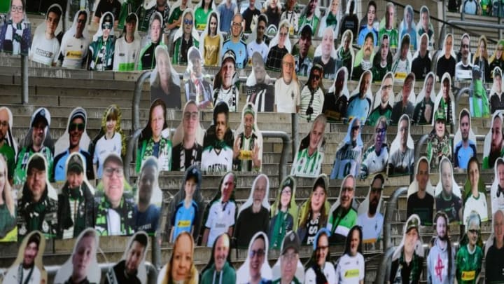 Cardboard cut-outs with portraits of Borussia Moenchegladbach's supporters are seen at the Borussia Park football stadium in Moenchengladbach, western Germany, on April 16, 2020, amid the novel coronavirus COVID-19 pandemic. - Large-scale public events such as football matches will remain banned in Germany until August 31 due to the coronavirus crisis, Berlin said on Wednesday, April 15, 2020, though it did not rule out allowing Bundesliga games to continue behind closed doors. (Photo by Ina FASSBENDER / AFP) (Photo by INA FASSBENDER/AFP via Getty Images)