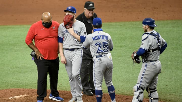 ST PETERSBURG, FLORIDA - JULY 26: Ken Giles #51 of the Toronto Blue Jays is pulled from the game by Charlie Montoyo #25 during the at bat with Ji-Man Choi #26 of the Tampa Bay Rays (not pictured) in the ninth inning at Tropicana Field on July 26, 2020 in St Petersburg, Florida. (Photo by Douglas P. DeFelice/Getty Images)