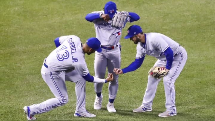 BOSTON, MA - APRIL 21: Lourdes Gurriel Jr., Jonathan Davis and Randal Grichuk #15 of the Toronto Blue Jays react after a victory over the Boston Red Sox at Fenway Park on April 21, 2021 in Boston, Massachusetts. (Photo by Adam Glanzman/Getty Images)