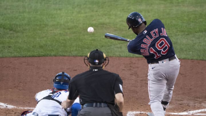 Aug 25, 2020; Buffalo, NY, USA; Boston Red Sox center fielder Jackie Bradley Jr. (19) hits an infield RBI single against the Toronto Blue Jays during the fourth inning at Sahlen Field. Mandatory Credit: Gregory Fisher-USA TODAY Sports