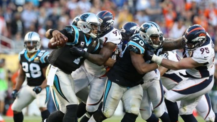 Feb 7, 2016; Santa Clara, CA, USA; Carolina Panthers quarterback Cam Newton (1) is hit by Denver Broncos defensive end Malik Jackson (97) in Super Bowl 50 at Levi