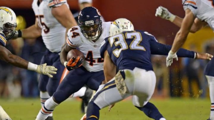 Nov 9, 2015; San Diego, CA, USA; Chicago Bears running back Antone Smith (44) is defended by San Diego Chargers free safety Eric Weddle (32) on a fourth quarter run at Qualcomm Stadium. Mandatory Credit: Jake Roth-USA TODAY Sports