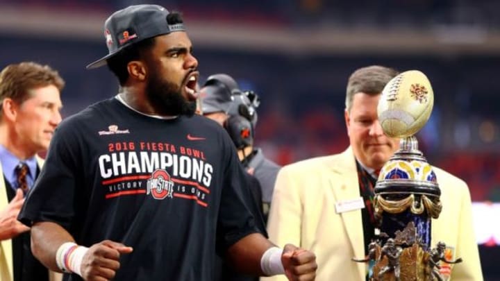 Jan 1, 2016; Glendale, AZ, USA; Ohio State Buckeyes running back Ezekiel Elliott celebrates with the trophy following the game against the Notre Dame Fighting Irish during the 2016 Fiesta Bowl at University of Phoenix Stadium. The Buckeyes defeated the Fighting Irish 44-28. Mandatory Credit: Mark J. Rebilas-USA TODAY Sports