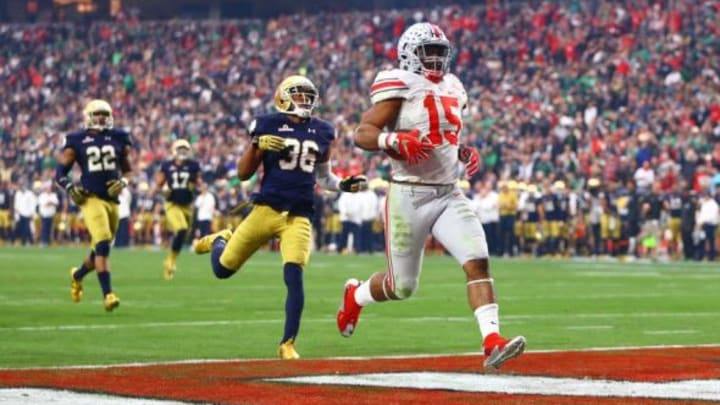 Jan 1, 2016; Glendale, AZ, USA; Ohio State Buckeyes running back Ezekiel Elliott (15) runs into the end zone for a second half against the Notre Dame Fighting Irish during the 2016 Fiesta Bowl at University of Phoenix Stadium. The Buckeyes defeated the Fighting Irish 44-28. Mandatory Credit: Mark J. Rebilas-USA TODAY Sports