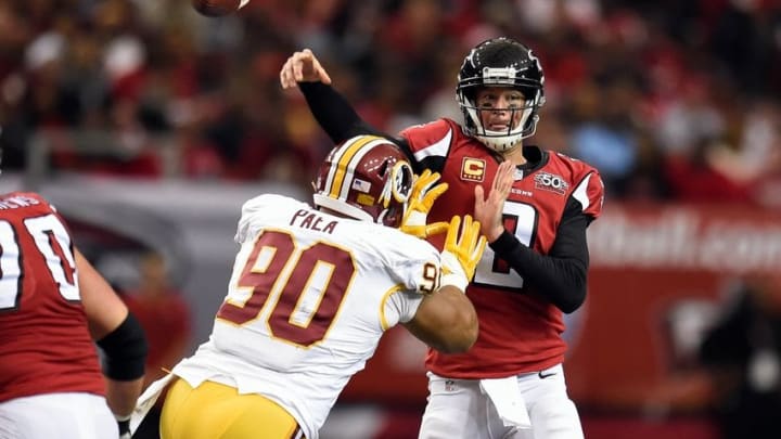 Oct 11, 2015; Atlanta, GA, USA; Atlanta Falcons quarterback Matt Ryan (2) passes against the pass rush from Washington Redskins defensive end Stephen Paea (90) during the second half at the Georgia Dome. The Falcons defeated the Redskins 25-19 in overtime. Mandatory Credit: Dale Zanine-USA TODAY Sports