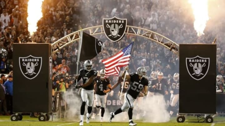 Nov 6, 2016; Oakland, CA, USA; Oakland Raiders long snapper Jon Condo (59) and punter Marquette King (7) run onto the field before the start of the game against the Denver Broncos at Oakland Coliseum. The Raiders defeated the Broncos 30-20. Mandatory Credit: Cary Edmondson-USA TODAY Sports