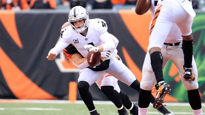 CINCINNATI, OH – DECEMBER 16: Derek Carr #4 of the Oakland Raiders fumbles the ball as he is sacked by Sam Hubbard #94 of the Cincinnati Bengals at Paul Brown Stadium on December 16, 2018 in Cincinnati, Ohio. (Photo by Andy Lyons/Getty Images)