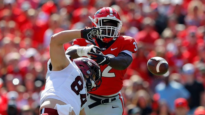 ATHENS, GEORGIA – OCTOBER 12: Monty Rice #32 of the Georgia Bulldogs breaks up this reception intended for Kyle Markway #84 of the South Carolina Gamecocks in the first half at Sanford Stadium on October 12, 2019 in Athens, Georgia. (Photo by Kevin C. Cox/Getty Images)