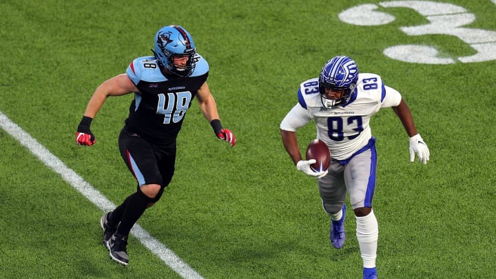 ARLINGTON, TEXAS – FEBRUARY 09: Greer Martini #48 of the Dallas Renegades pursues Wes Saxton #83 of the St. Louis Battlehawks in the third quarter at an XFL Game on February 09, 2020 in Arlington, Texas. (Photo by Richard Rodriguez/Getty Images)
