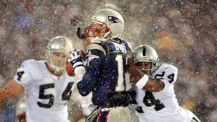 Charles Woodson sacks Tom Brady (Photo credit should read MATT CAMPBELL/AFP via Getty Images)