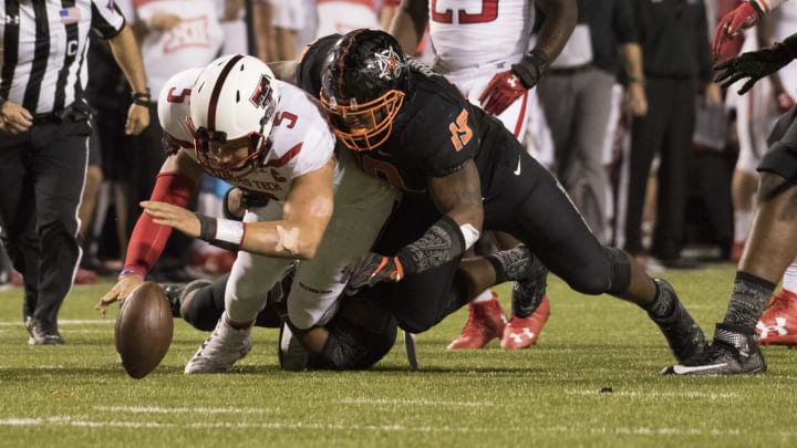 STILLWATER, OK – NOVEMBER 12: Linebacker Justin Phillips #19 of the Oklahoma State Cowboys sacks quarterback Patrick Mahomes II #5 of the Texas Tech Red Raiders during the second half of a NCAA football game November 12, 2016 at Pickens Stadium in Stillwater, Oklahoma. OSU won 45-44. (Photo by J Pat Carter/Getty Images)