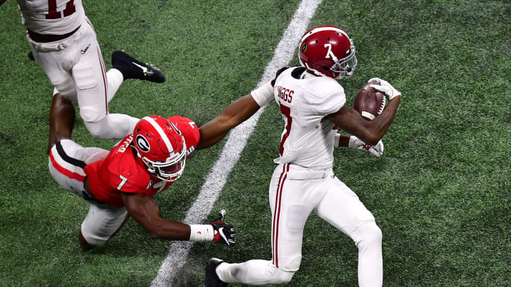 ATLANTA, GA – JANUARY 08: Trevon Diggs #7 of the Alabama Crimson Tide breaks the tackle of Lorenzo Carter #7 of the Georgia Bulldogs in the CFP National Championship presented by AT&T at Mercedes-Benz Stadium on January 8, 2018 in Atlanta, Georgia. (Photo by Scott Cunningham/Getty Images)
