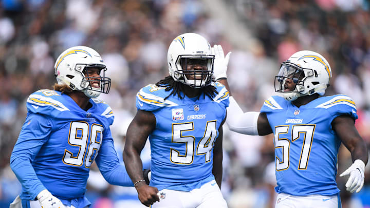 CARSON, CA – OCTOBER 07: Defensive end Melvin Ingram #54 of the Los Angeles Chargers celebrates a sack with defensive end Isaac Rochell #98 and outside linebacker Jatavis Brown #57 in the first quarter against the Oakland Raiders at StubHub Center on October 7, 2018 in Carson, California. (Photo by Harry How/Getty Images)