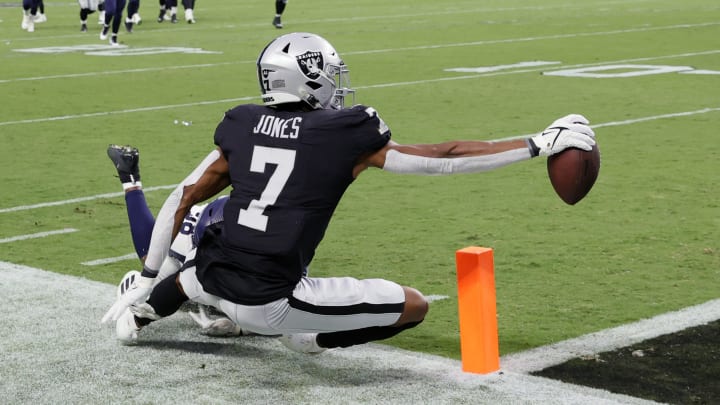 LAS VEGAS, NEVADA – AUGUST 14: Wide receiver Zay Jones #7 of the Las Vegas Raiders lands out of bounds as he reaches for the end zone after making a catch against defensive end Alton Robinson #98 of the Seattle Seahawks during a preseason game at Allegiant Stadium on August 14, 2021, in Las Vegas, Nevada. The Raiders defeated the Seahawks 20-7. (Photo by Ethan Miller/Getty Images)