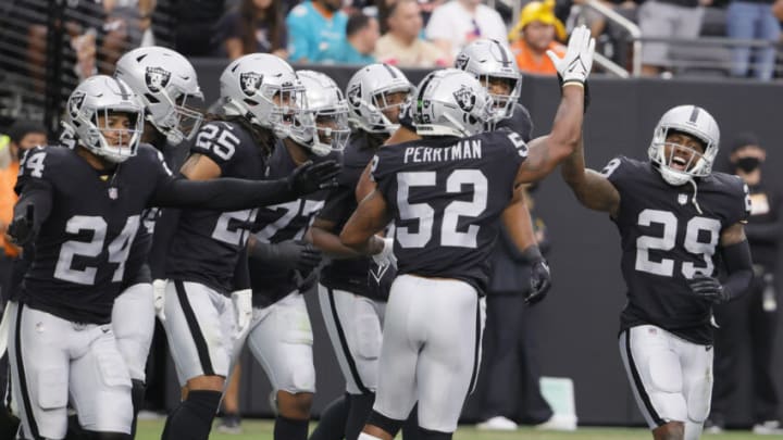 LAS VEGAS, NEVADA - SEPTEMBER 26: Cornerback Casey Hayward Jr. #29 of the Las Vegas Raiders high-fives inside linebacker Denzel Perryman #52 after Hayward tackled Jaylen Waddle #17 of the Miami Dolphins in the end zone for a safety during their game at Allegiant Stadium on September 26, 2021 in Las Vegas, Nevada. The Raiders defeated the Dolphins 31-28 in overtime. (Photo by Ethan Miller/Getty Images)