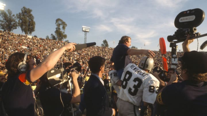 PASADENA, CA- JANUARY 9: Head Coach John Madden of the Oakland Raiders gets carried off the field by Ted Hendricks #83 and John Matuszak #72 after they defeated the Minnesota Vikings in Super Bowl XI on January 9, 1977 at the Rose Bowl in Pasadena, California. The Raiders won the Super Bowl 32 -14. (Photo by Focus on Sport/Getty Images)