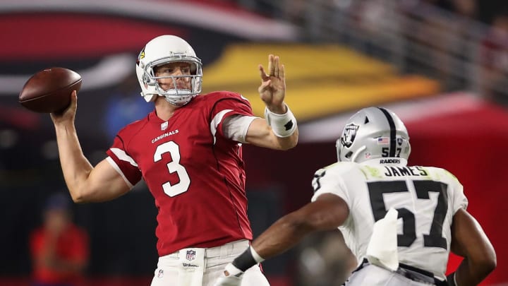GLENDALE, AZ – AUGUST 12: Quarterback Carson Palmer No. 3 of the Arizona Cardinals throws a pass over middle linebacker Cory James No. 57 of the Oakland Raiders during the first half of the NFL game at the University of Phoenix Stadium on August 12, 2017 in Glendale, Arizona. (Photo by Christian Petersen/Getty Images)