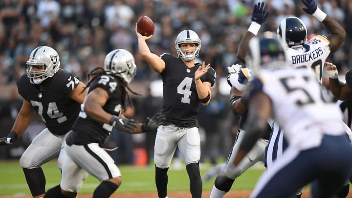 OAKLAND, CA – AUGUST 19: Derek Carr No. 4 of the Oakland Raiders looks to throw a pass against the Los Angeles Rams during the first quarter of their preseason NFL football game at Oakland-Alameda County Coliseum on August 19, 2017 in Oakland, California. (Photo by Thearon W. Henderson/Getty Images)