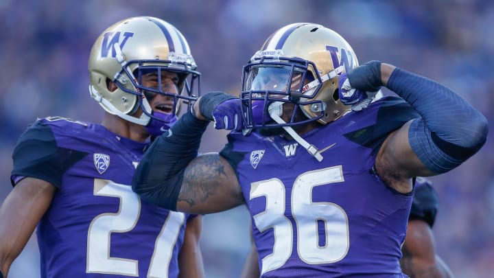 SEATTLE, WA – OCTOBER 28: Azeem Victor #36 of the Washington Huskies celebrates with Keith Taylor #27 after making a solo tackle on a kickoff in the third quarter against the UCLA Bruins at Husky Stadium on October 28, 2017 in Seattle, Washington. (Photo by Otto Greule Jr/Getty Images)