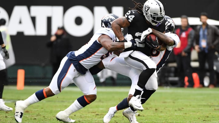 OAKLAND, CA – NOVEMBER 26: Marshawn Lynch No. 24 of the Oakland Raiders rushes with the ball against the Denver Broncos during their NFL game at Oakland-Alameda County Coliseum on November 26, 2017 in Oakland, California. (Photo by Robert Reiners/Getty Images)