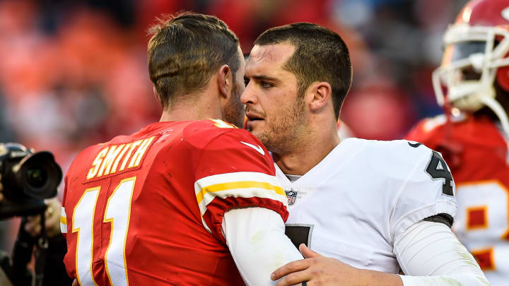 KANSAS CITY, MO – DECEMBER 10: Quarterback Derek Carr No. 4 of the Oakland Raiders exchanges words and a hug with quarterback Alex Smith No. 11 of the Kansas City Chiefs following the game at Arrowhead Stadium on December 10, 2017 in Kansas City, Missouri. (Photo by Jason Hanna/Getty Images)