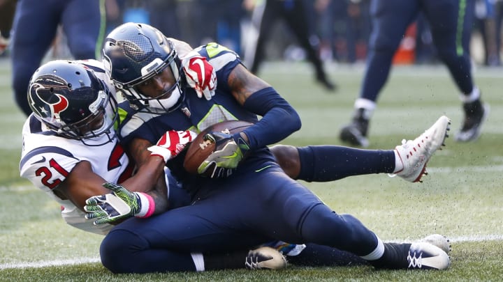 SEATTLE, WA – OCTOBER 29: Wide receiver Paul Richardson No. 10 of the Seattle Seahawks pulls in a touchdown against safety Marcus Gilchrist No. 21 of the Houston Texans that is nullified due to a penalty during the fourth quarter of the game at CenturyLink Field on October 29, 2017 in Seattle, Washington. (Photo by Jonathan Ferrey/Getty Images)