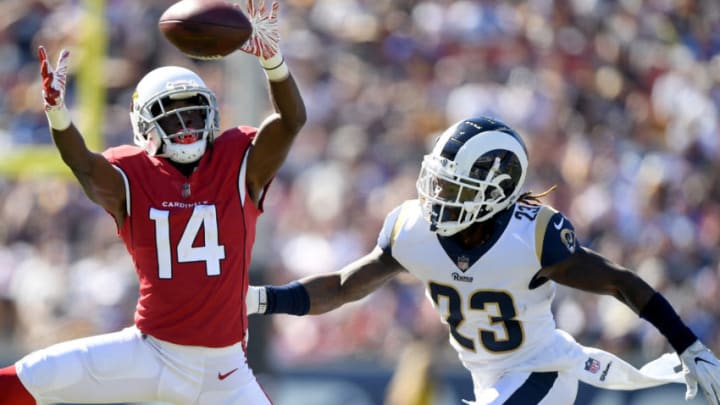 LOS ANGELES, CA - SEPTEMBER 16: J.J. Nelson #14 of the Arizona Cardinals attempts a catch in front of Nickell Robey-Coleman #23 of the Los Angeles Rams during a 34-0 Rams win at Los Angeles Memorial Coliseum on September 16, 2018 in Los Angeles, California. (Photo by Harry How/Getty Images)