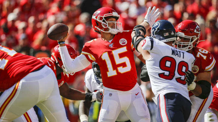 KANSAS CITY, MO – OCTOBER 13: Patrick Mahomes #15 of the Kansas City Chiefs throws a second quarter pass before the defensive pressure by J.J. Watt #99 of the Houston Texans at Arrowhead Stadium on October 13, 2019 in Kansas City, Missouri. (Photo by David Eulitt/Getty Images)