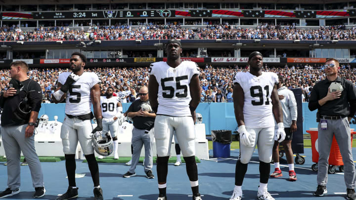 NASHVILLE, TN – SEPTEMBER 25: Divine Deablo #5, Chandler Jones #55, and Bilal Nichols #91 of the Las Vegas Raiders stand on the sidelines before an NFL football game against the Tennessee Titans at Nissan Stadium on September 25, 2022, in Nashville, Tennessee. (Photo by Kevin Sabitus/Getty Images)